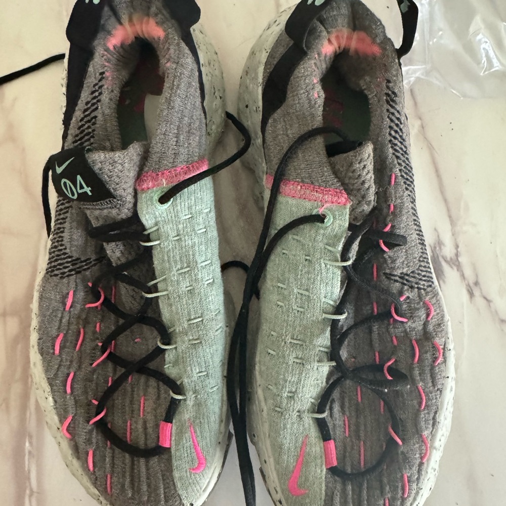 Nike Gray and Pink Sneakers with Breathable Mesh Upper and Substantial Sole